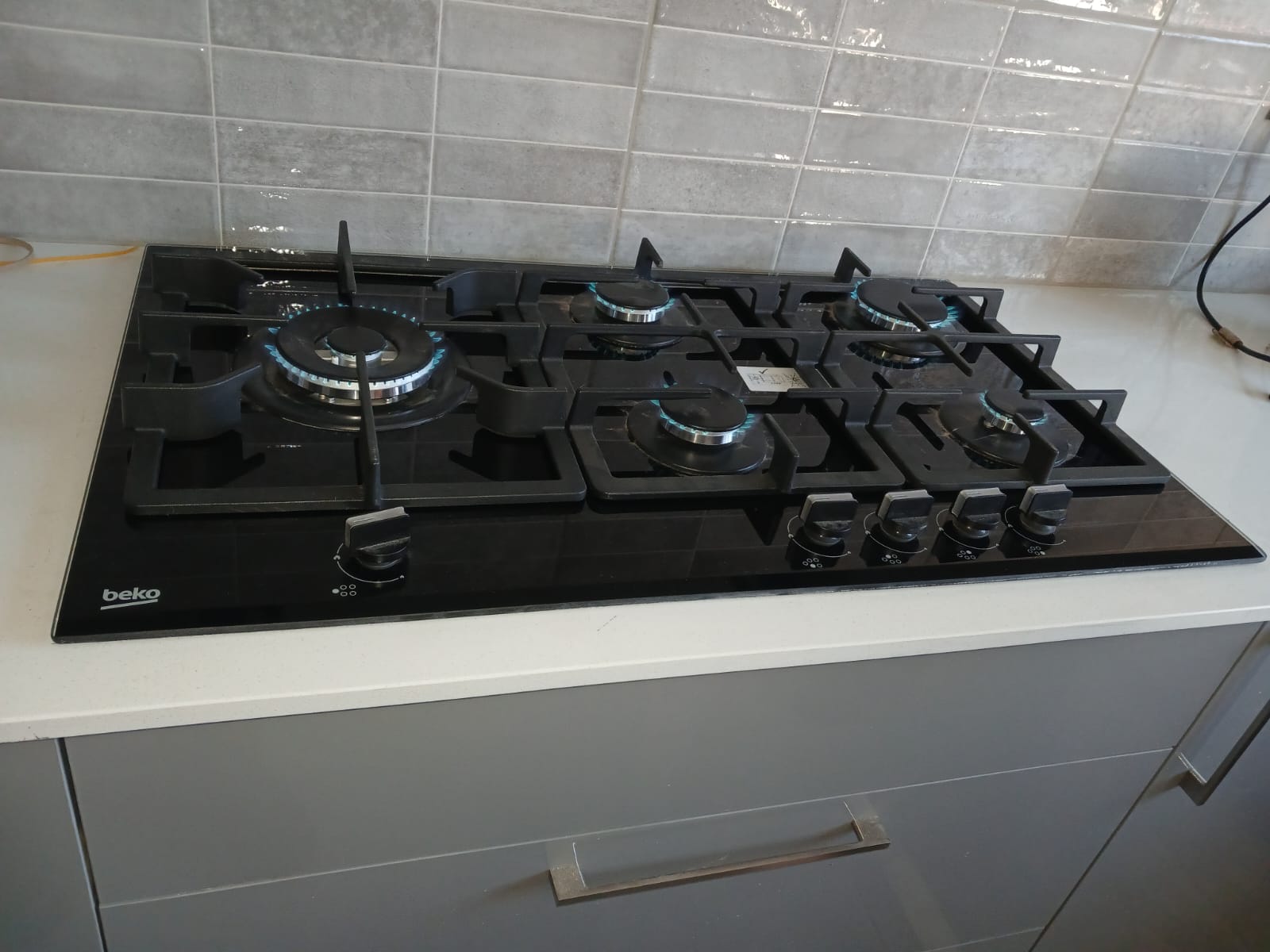 Beko 5-burner black glass hob gas installation in Sandton kitchen